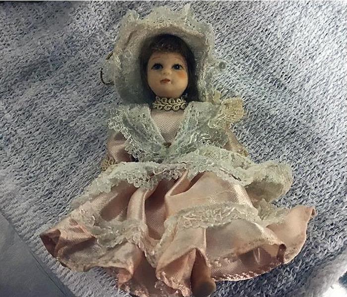 Porcelain doll restored to pre-loss condition