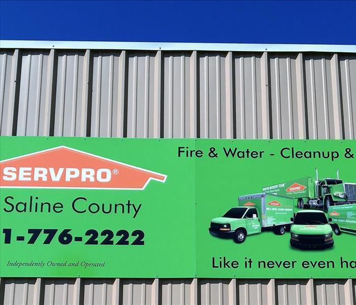 SERVPRO sign - WE'RE HERE!