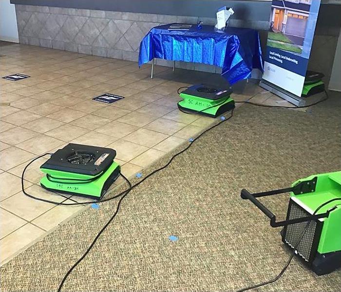 SERVPRO equipment dries the front lobby of a bank