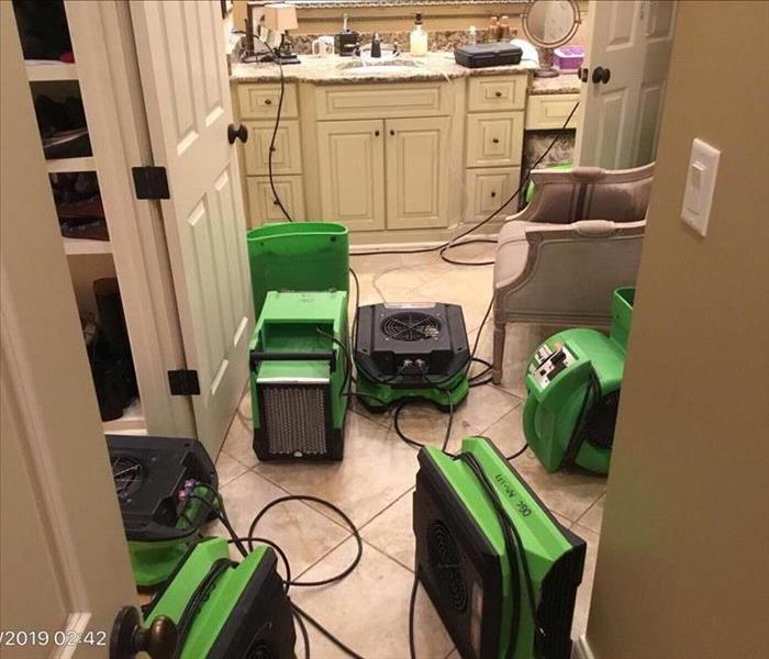 dehus and air movers set in bathroom