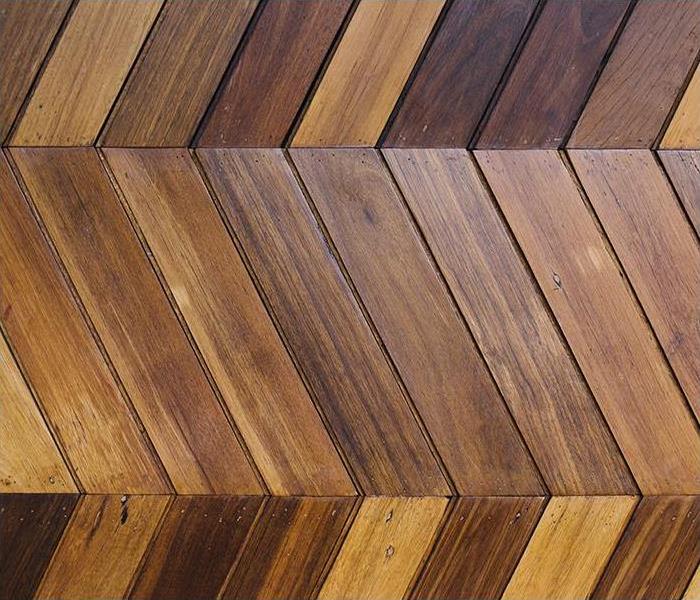 Brown laminate floor arranged in a pattern