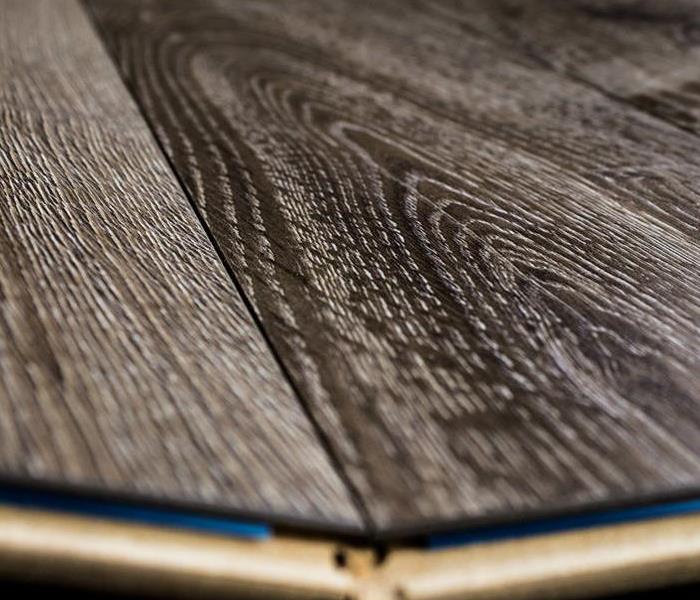 Dark laminate wood floor planks joined together