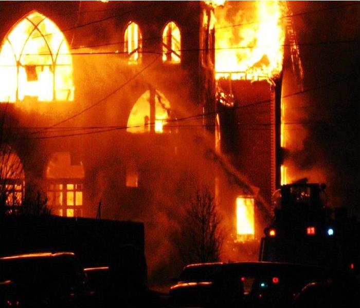 A church is engulfed in flames.